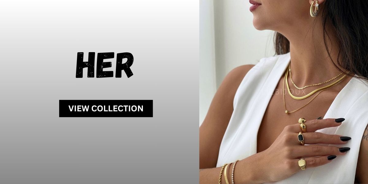 Woman wearing gold jewelry with 'HER' and 'VIEW COLLECTION' text on a gray background