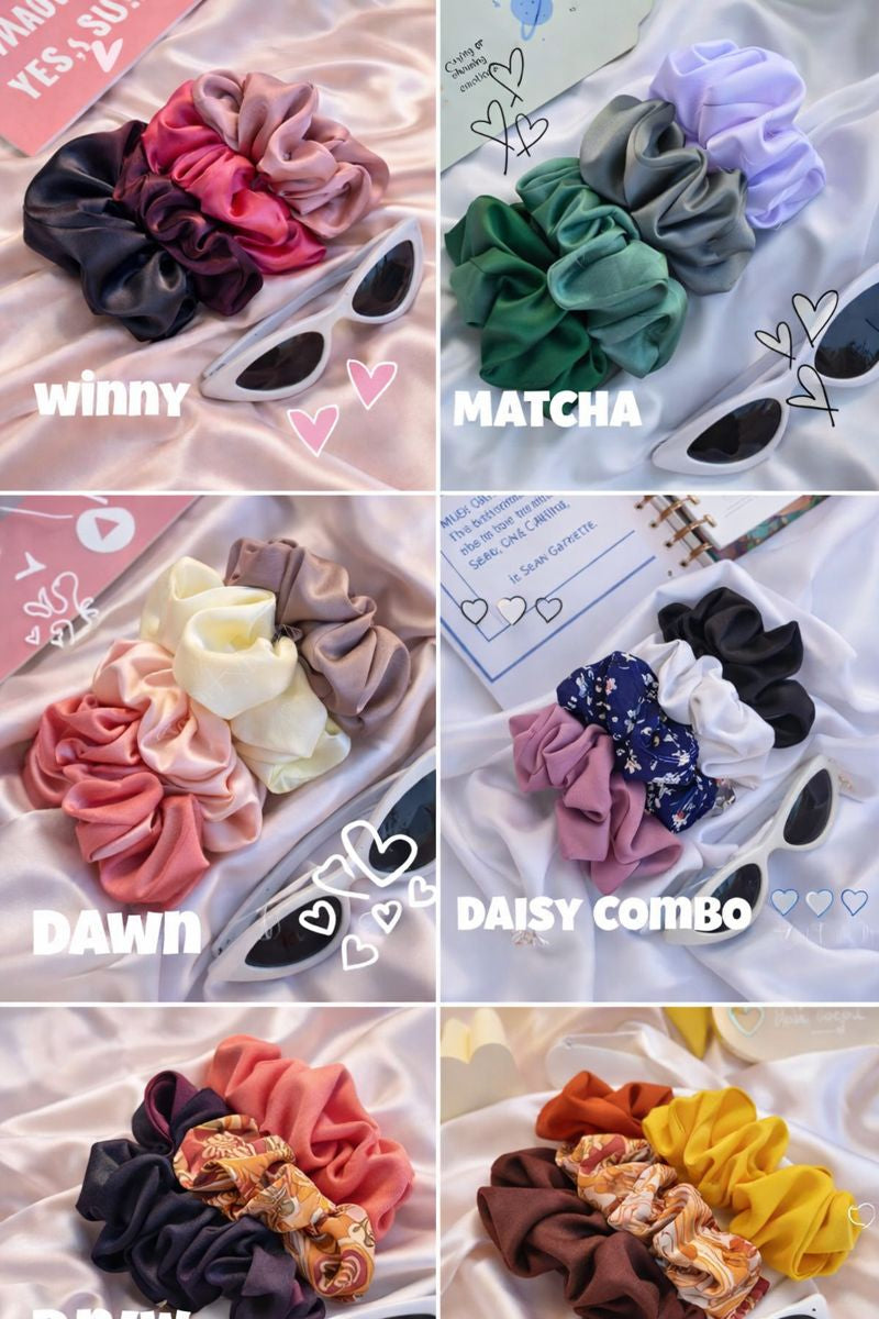 Collection of colorful scrunchies with labels 'Winnie', 'Matcha', 'Dawn', and 'Daisy Combo' on a white background.